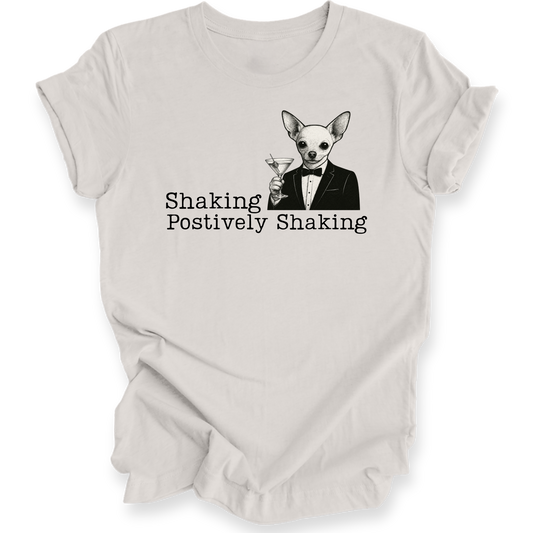 White t-shirt with a dog in a suit graphic and text 'Shaking Postively Shaking' on a white background