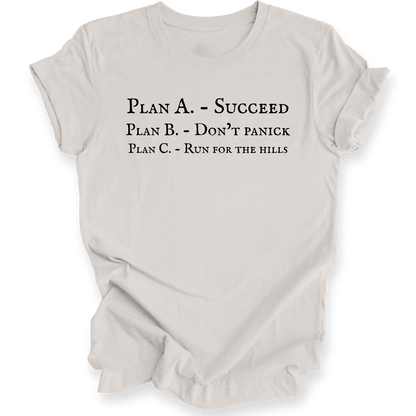 A light beige crewneck short-sleeve t-shirt with black printed text on the front reading 'PLAN A. - SUCCEED PLAN B. - DON'T PANICK PLAN C. RUN FOR THE HILLS'
