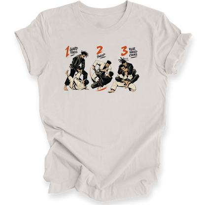 A light beige short-sleeve crewneck t-shirt featuring a graphic print of three martial arts figures in a sequence, labeled '1 Guard Pass', '2 SWEEP', and '3 REAR NAKED CHOKE' in orange and black text.