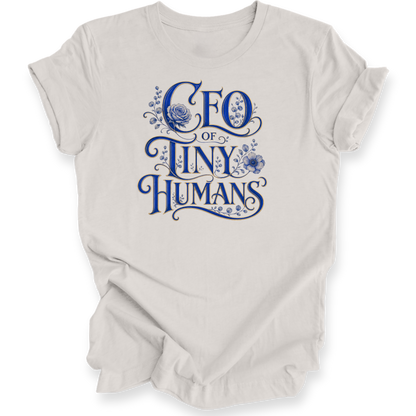 A light beige crewneck t-shirt with a blue graphic text print reading 'CEO OF TINY HUMANS' decorated with floral illustrations, shown on a plain white background.
