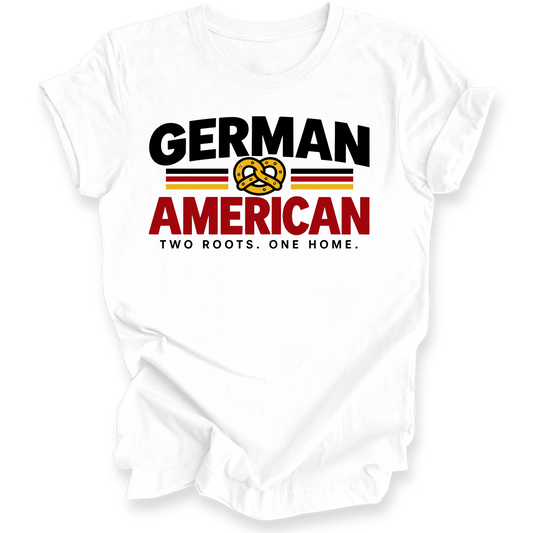 A white short-sleeve t-shirt with a graphic print on the front. The design features the words 'GERMAN AMERICAN' in bold black and red lettering, separated by a yellow pretzel symbol and flanked by thin red and black stripes.
