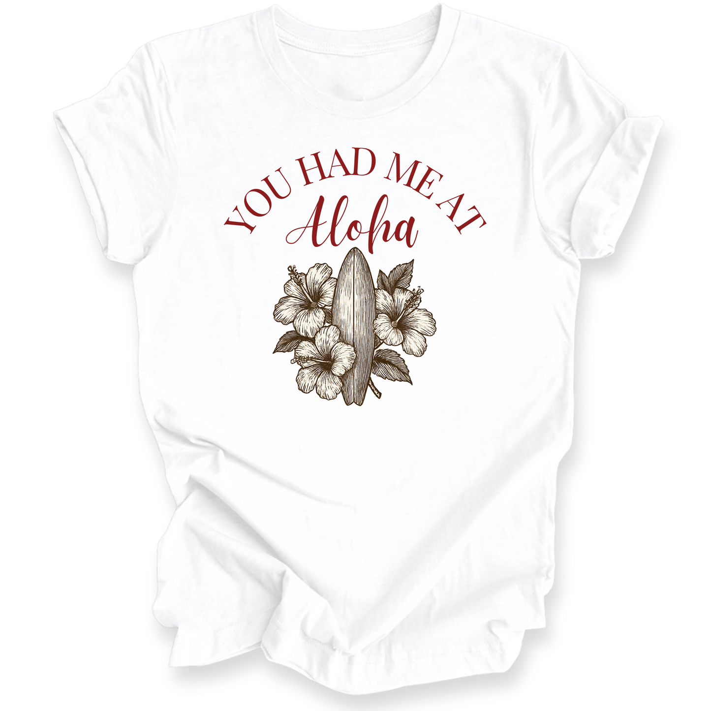 White t-shirt with red text 'YOU HAD ME AT Aloha' and floral design on a white background