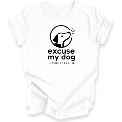 A white short-sleeve crewneck t-shirt with a black graphic print on the chest. The graphic features a stylized dog head inside a circle with the text 'excuse my dog' and 'HE THINKS YOU SMELL' underneath.
