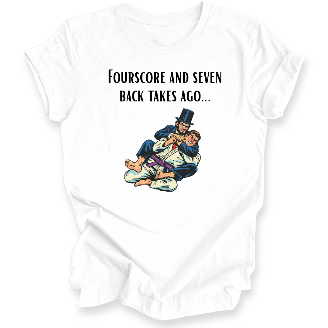 A white short-sleeve crewneck t-shirt with a graphic print on the front. The print features the text 'FOURSSCORE AND SEVEN BACK TAKES AGO.