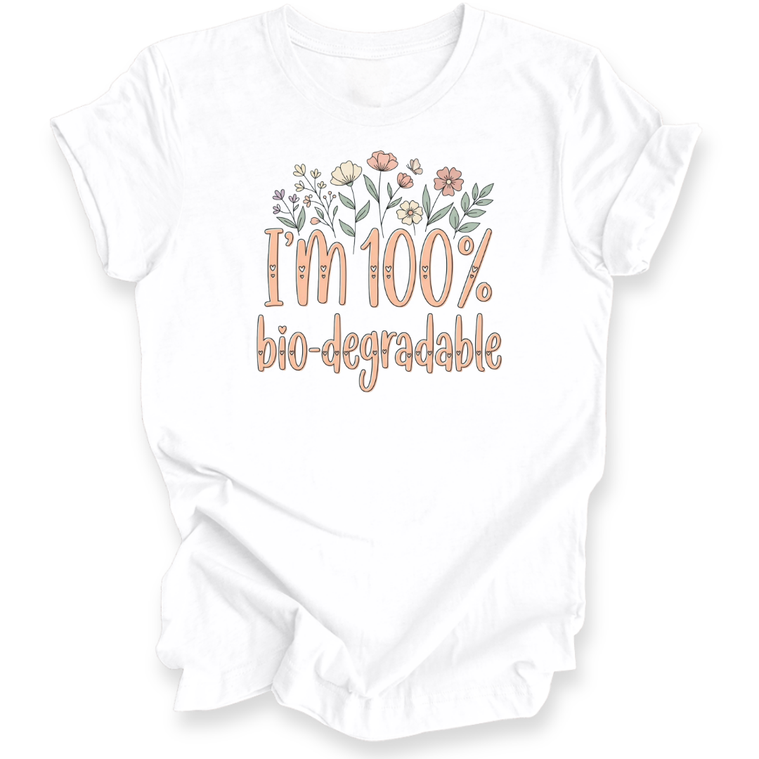 A white short-sleeve t-shirt with a graphic print that reads 'I'm 100% bio-degradable' in peach-colored lettering, decorated with small pastel flowers above the text.