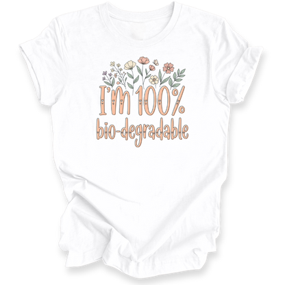 A white short-sleeve t-shirt with a graphic print that reads 'I'm 100% bio-degradable' in peach-colored lettering, decorated with small pastel flowers above the text.
