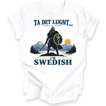 A white short-sleeve crewneck t-shirt with a graphic print of a Viking warrior, mountains, and pine trees, featuring the text 'TA DET LUGNT.