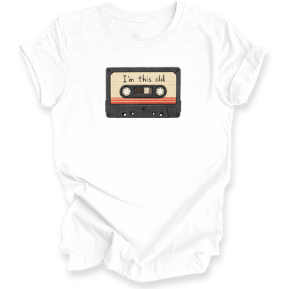 A white short-sleeve crewneck t-shirt featuring a graphic of a vintage cassette tape with the text 'I'm this old' printed on the label.
