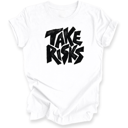 A white short-sleeve crewneck t-shirt with a bold black graphic text print reading 'TAKE RISKS' in a stylized, graffiti-like font on the chest, displayed against a clean white background.