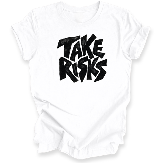 A white short-sleeve crewneck t-shirt with a bold black graphic text print reading 'TAKE RISKS' in a stylized, graffiti-like font on the chest, displayed against a clean white background.