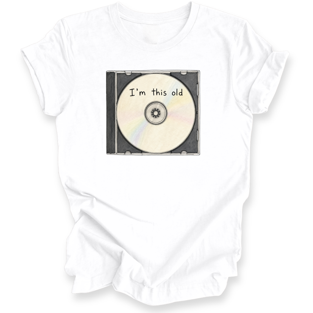 A white short-sleeve t-shirt with a graphic of a CD in a case that reads 'I'm this old' in black text, displayed on a clean white background.