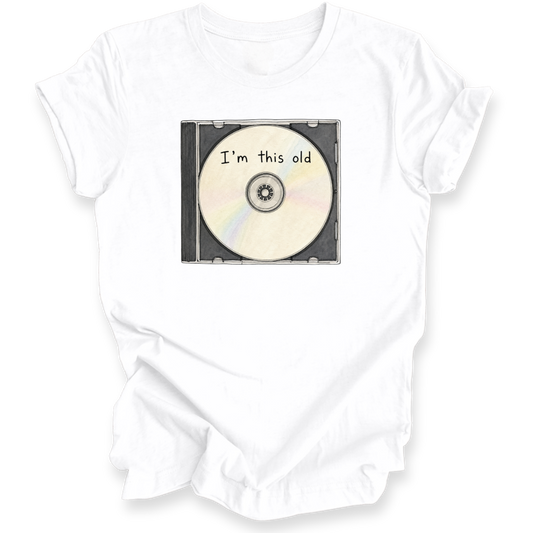 A white short-sleeve t-shirt with a graphic of a CD in a case that reads 'I'm this old' in black text, displayed on a clean white background.