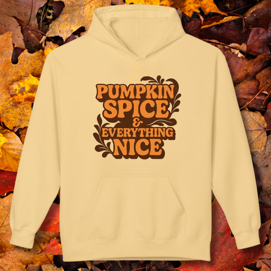 Beige hoodie with 'Pumpkin Spice & Everything Nice' text on a background of autumn leaves.